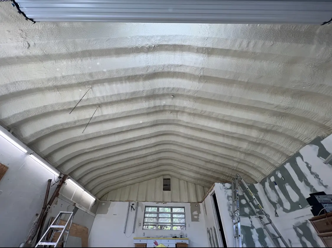 Spray polyurethane foam applied to the underside of a metal roof deck in Madera